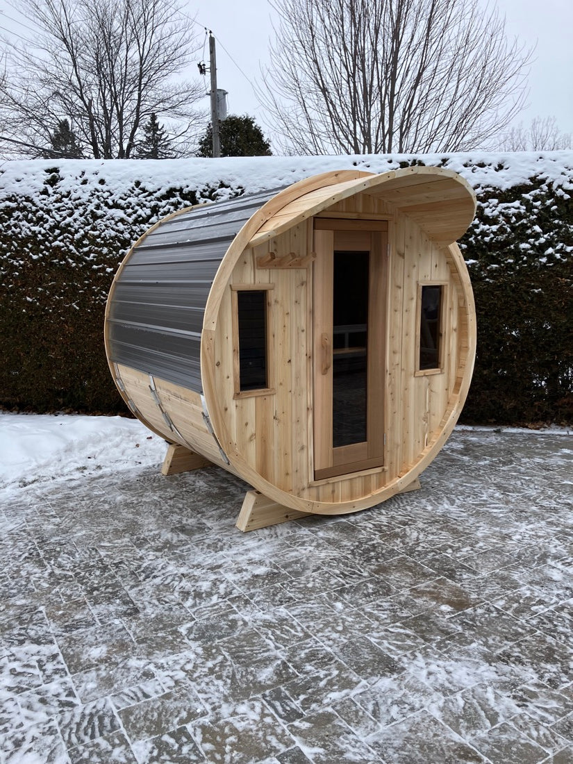 Brad's cedar barrel sauna after installation in winter
